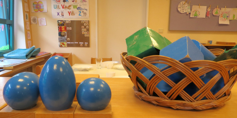 Montessori geometric solids and shapes in a classroom – hands-on learning materials for early childhood education