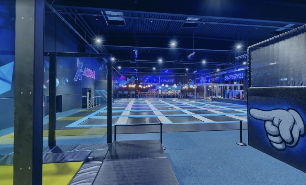 Kids indoor adventure center with trampolines and climbing challenges

