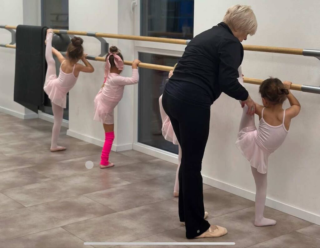 children doing tumbling rolls in a kids’ gymnastics session, indoor play activity