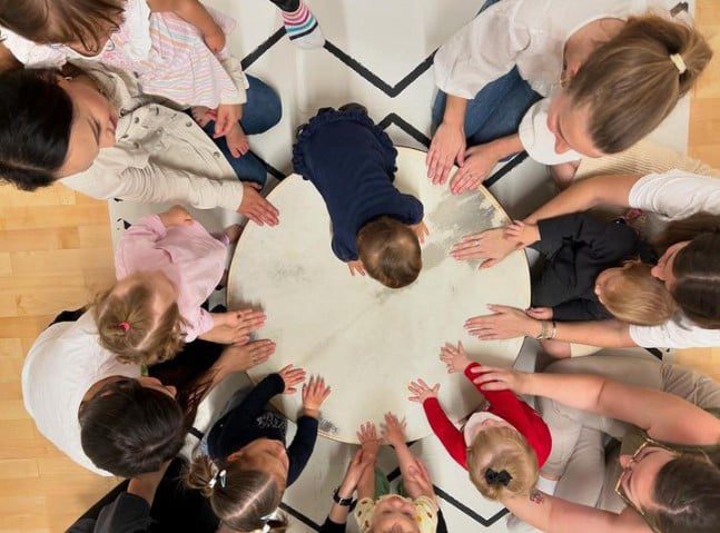Group activity fostering collaboration and respect in a child-centered learning approach, a key component of the Montessori method.

