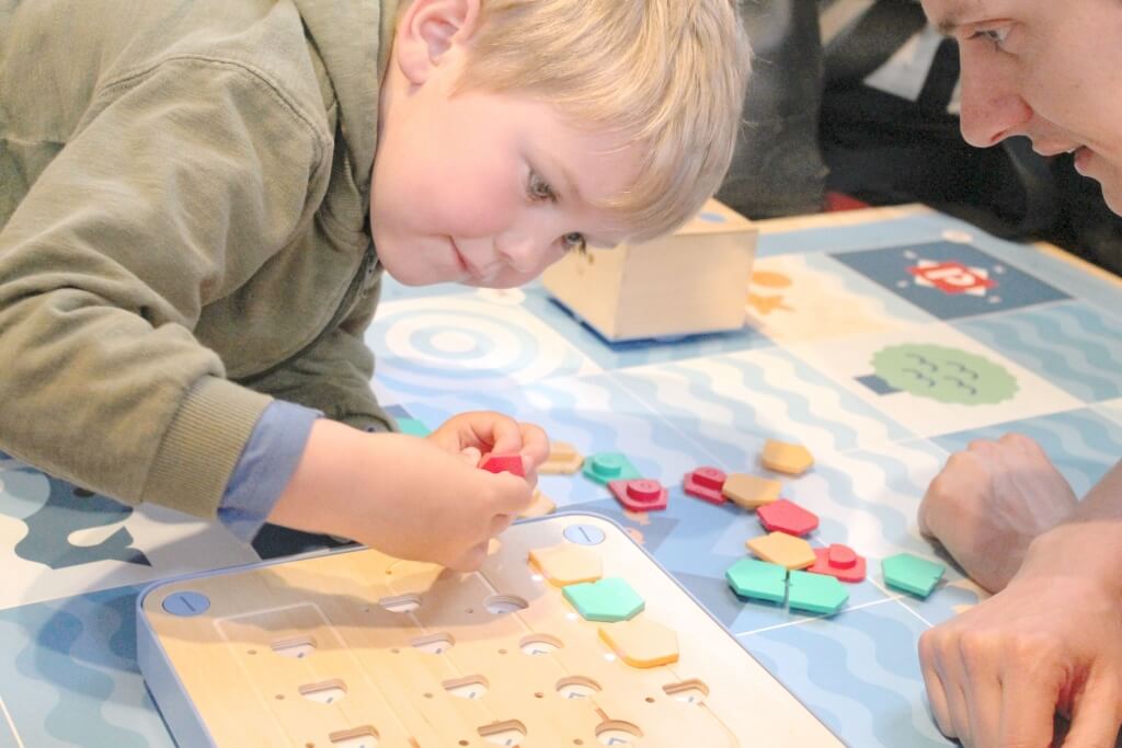 Child engaging with Cubetto and Montessori-friendly coding toys — demonstrating screen-free, hands-on Montessori coding for children.

