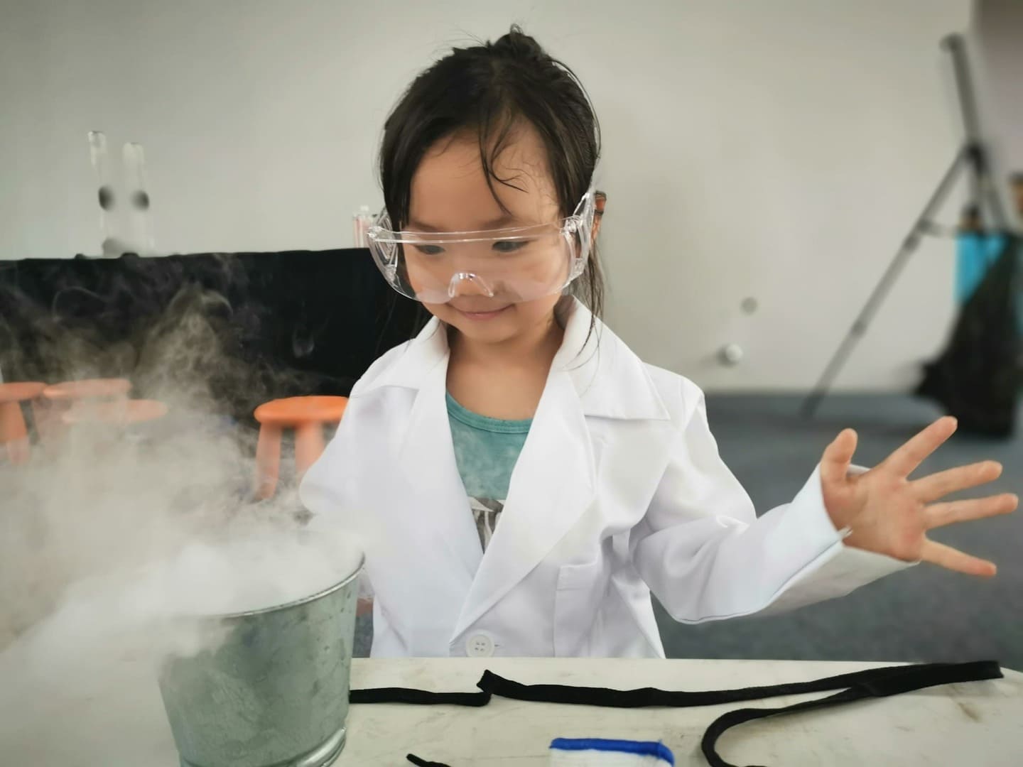 Montessori science in action with a child conducting a foggy experiment, illustrating curiosity-driven discovery and scientific observation