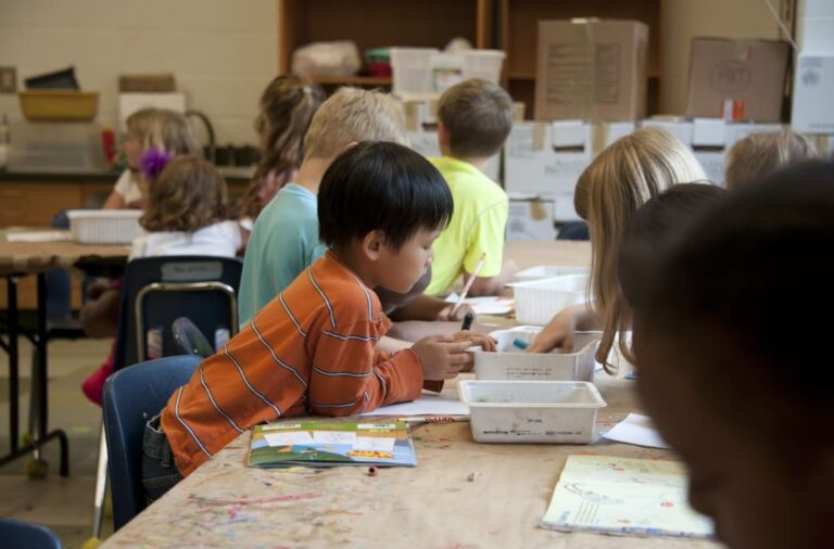 a Montessori curriculum in action: children in a classroom doing various activities