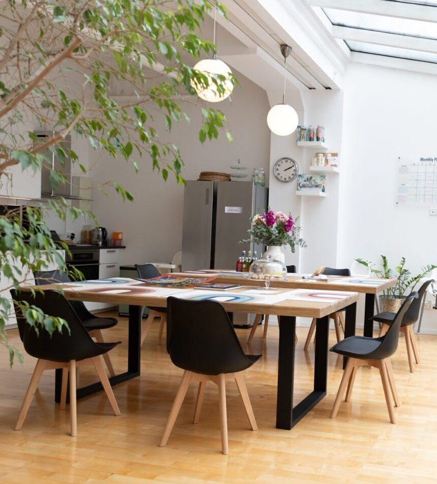 Shared workspace area with modern design at family-friendly coworking space at Montessori Family Center