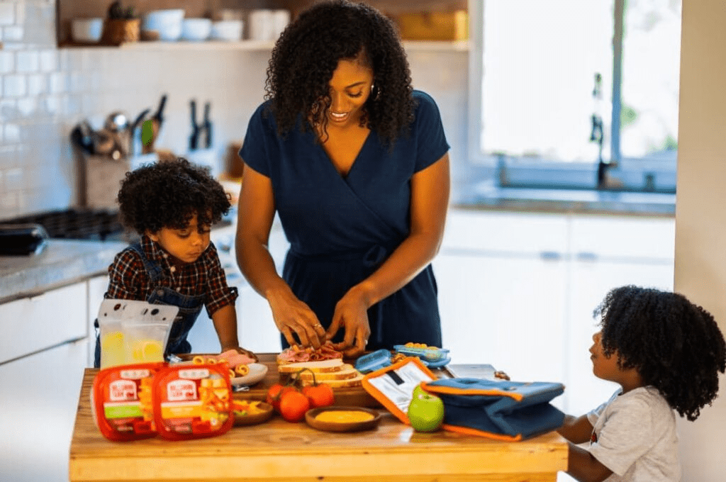 Mother with two children in a kitchen