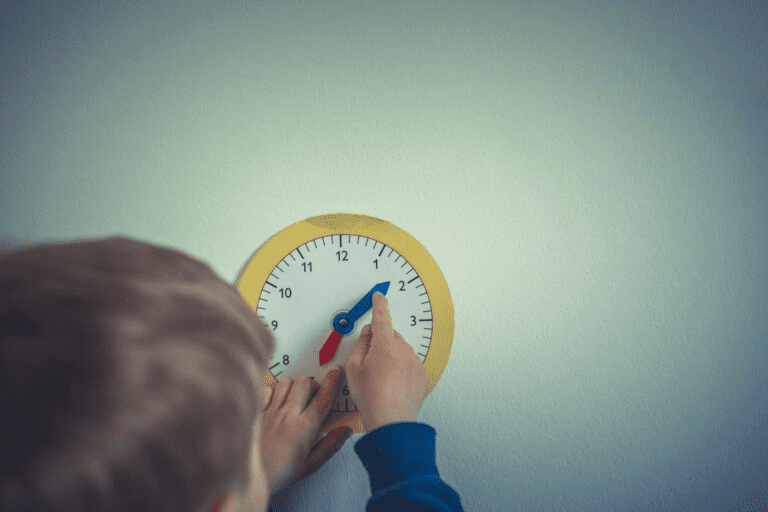 a child mowing arrows on a toy-watch on the wall